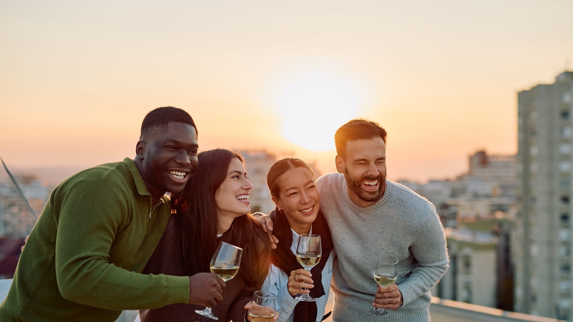A rooftop gathering at golden hour